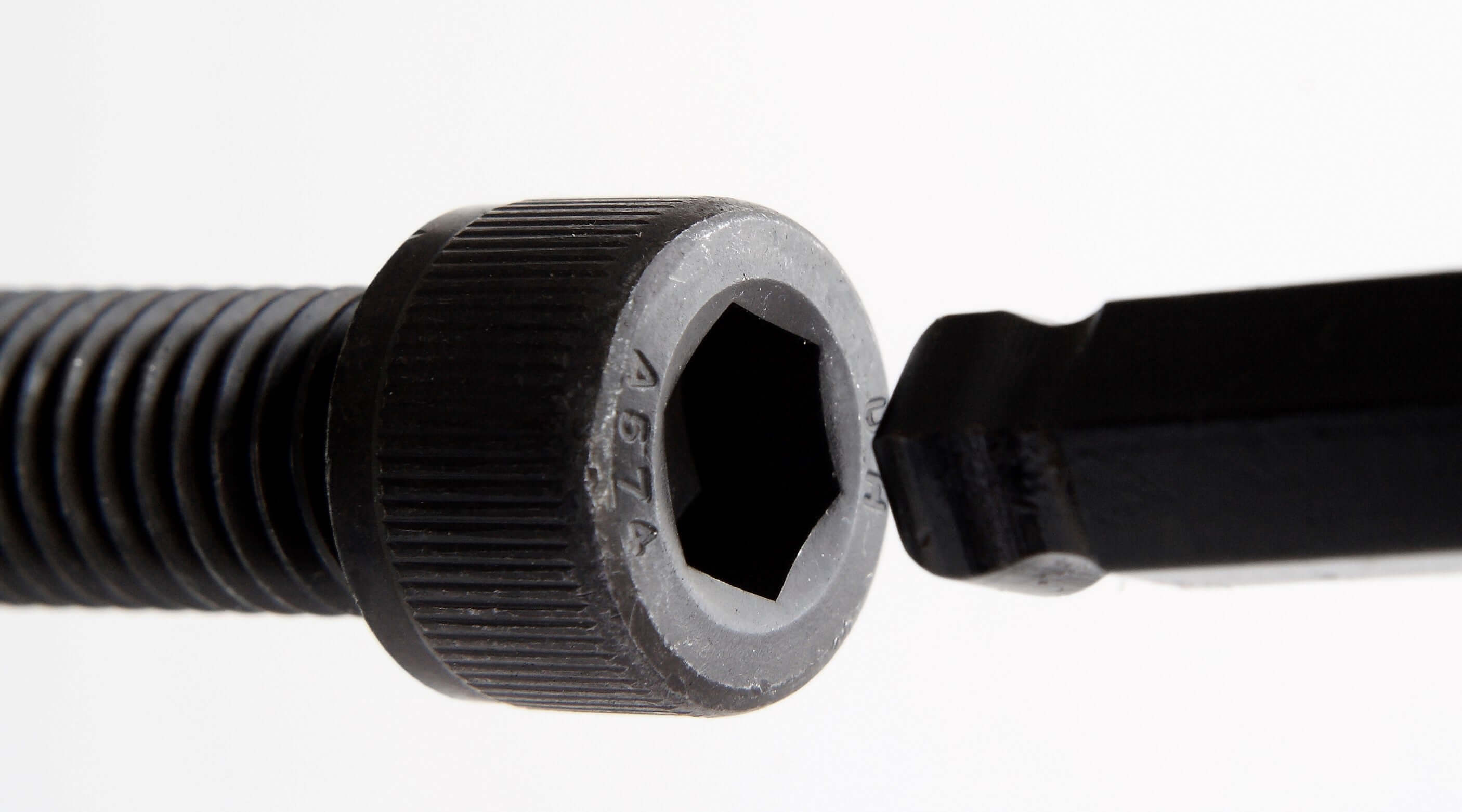 Close-up of an Allen key fitting into a hex screw, showcasing the design and function of Allen keys.
