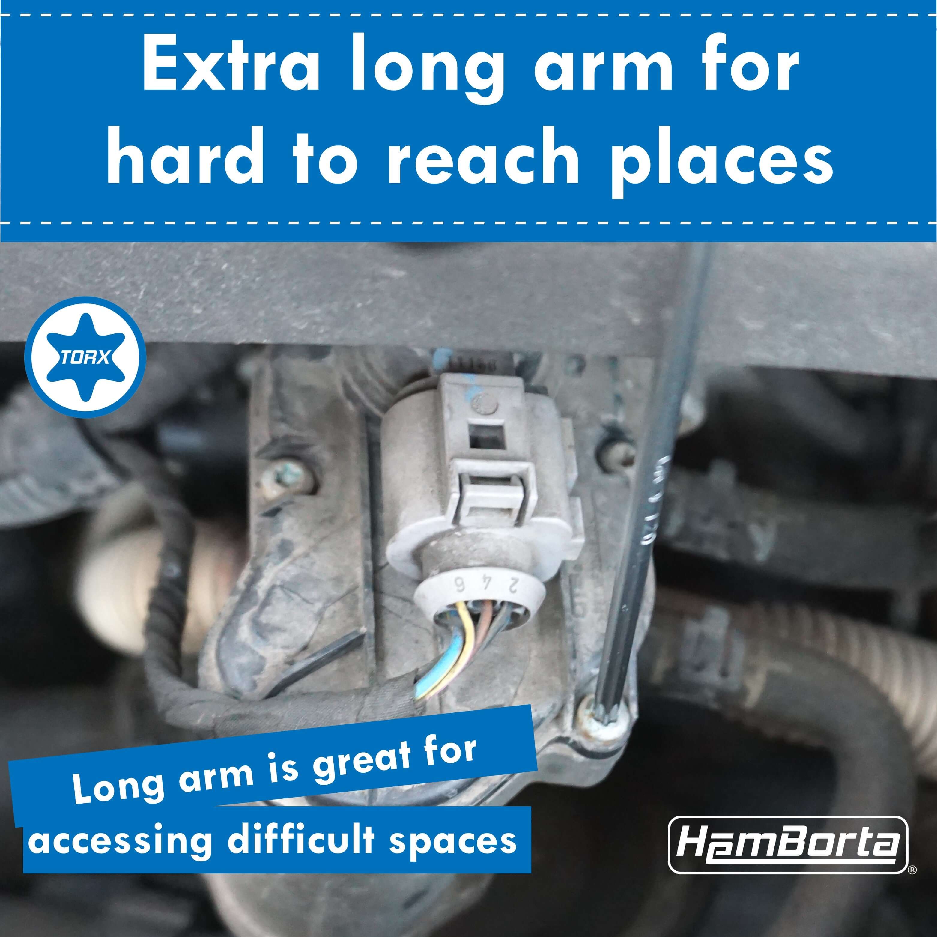 HemBorta extra long Torx key set being used in hard-to-reach space, ideal for accessing tight areas in vehicles.